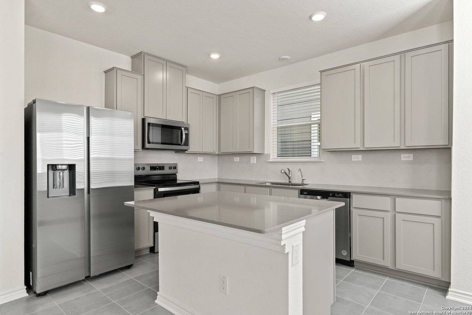 14839 Vance Jackson Road, Unit 910 San Antonio, TX 78249 - Photo 11 of 29 a kitchen with cabinets stainless steel appliances and a counter space