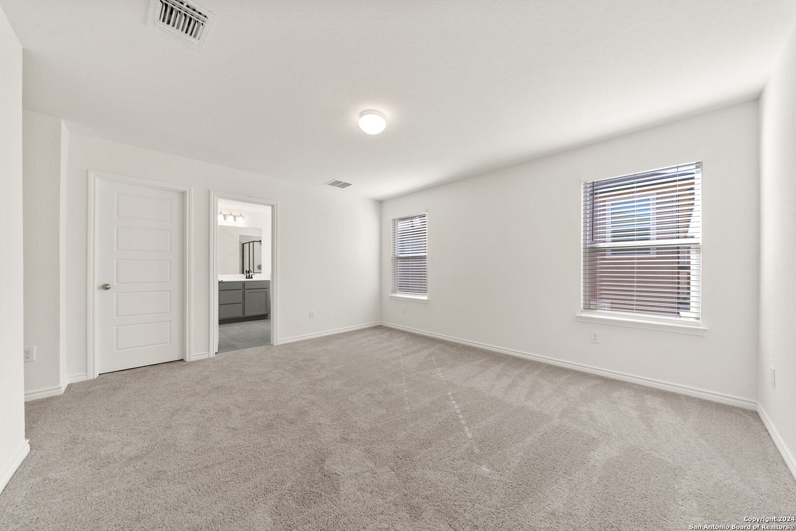 14839 Vance Jackson Road, Unit 910 San Antonio, TX 78249 - Photo 18 of 29 an empty room with windows