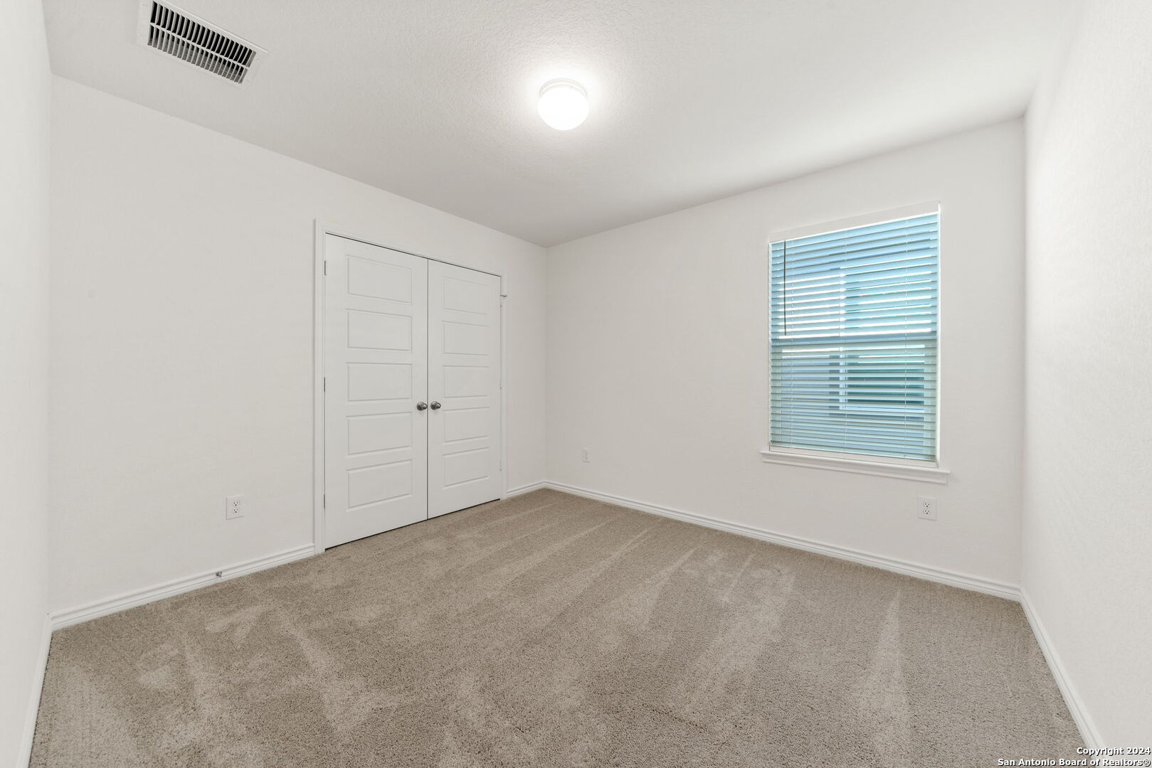 14839 Vance Jackson Road, Unit 910 San Antonio, TX 78249 - Photo 21 of 29 an empty room with windows
