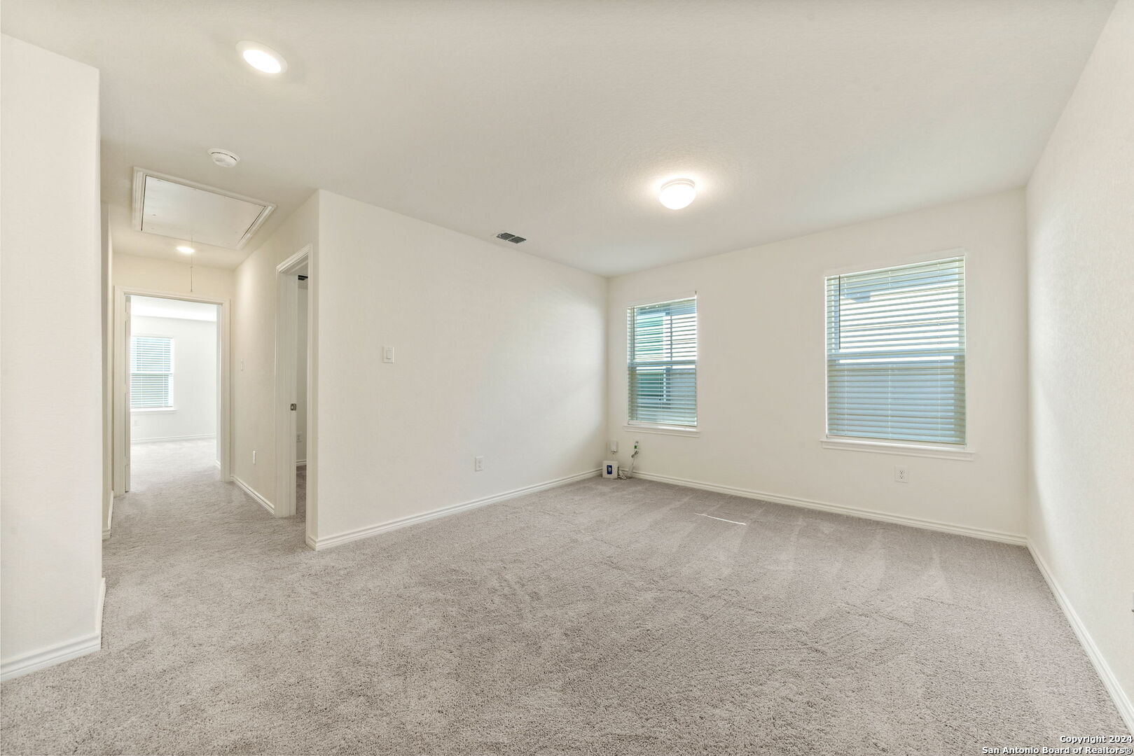 14839 Vance Jackson Road, Unit 910 San Antonio, TX 78249 - Photo 25 of 29 an empty room with windows and closet