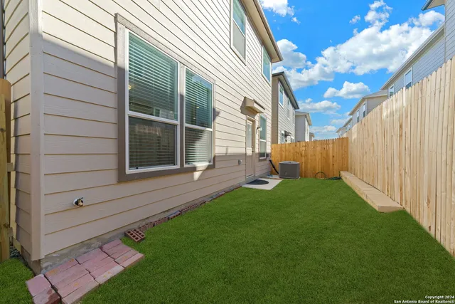 a view of backyard with a garden and plants