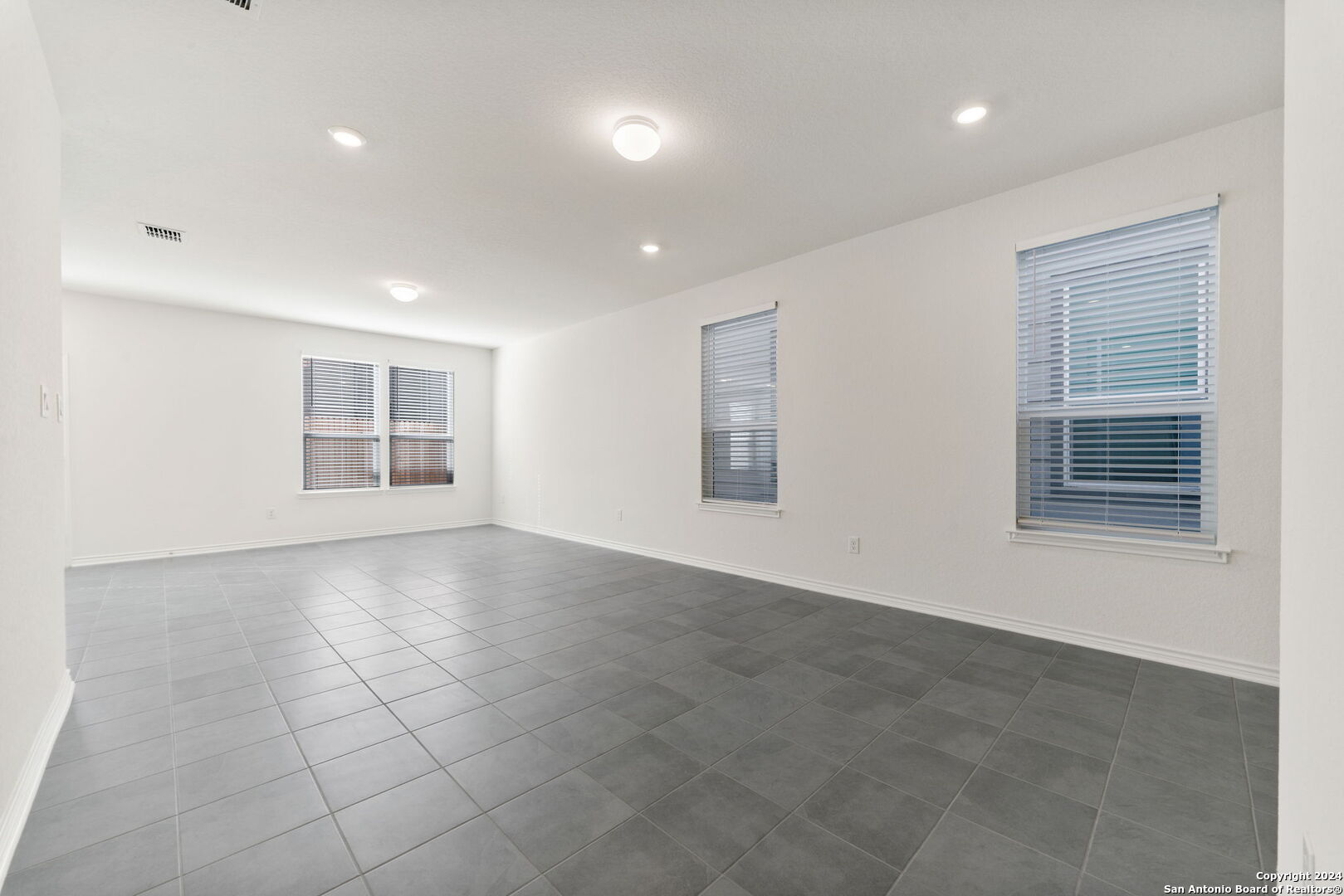 14839 Vance Jackson Road, Unit 910 San Antonio, TX 78249 - Photo 6 of 29 a view of an empty room with a window