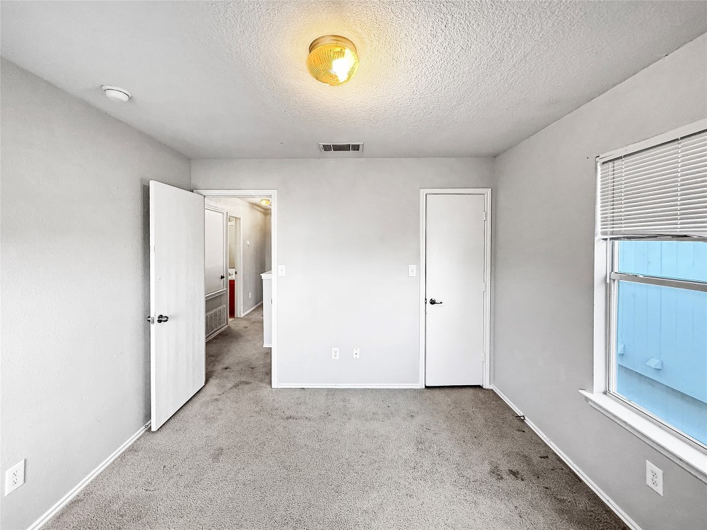 4516 Felicity Lane Austin, TX 78725 - Photo 15 of 15 a view of a hallway to a bedroom
