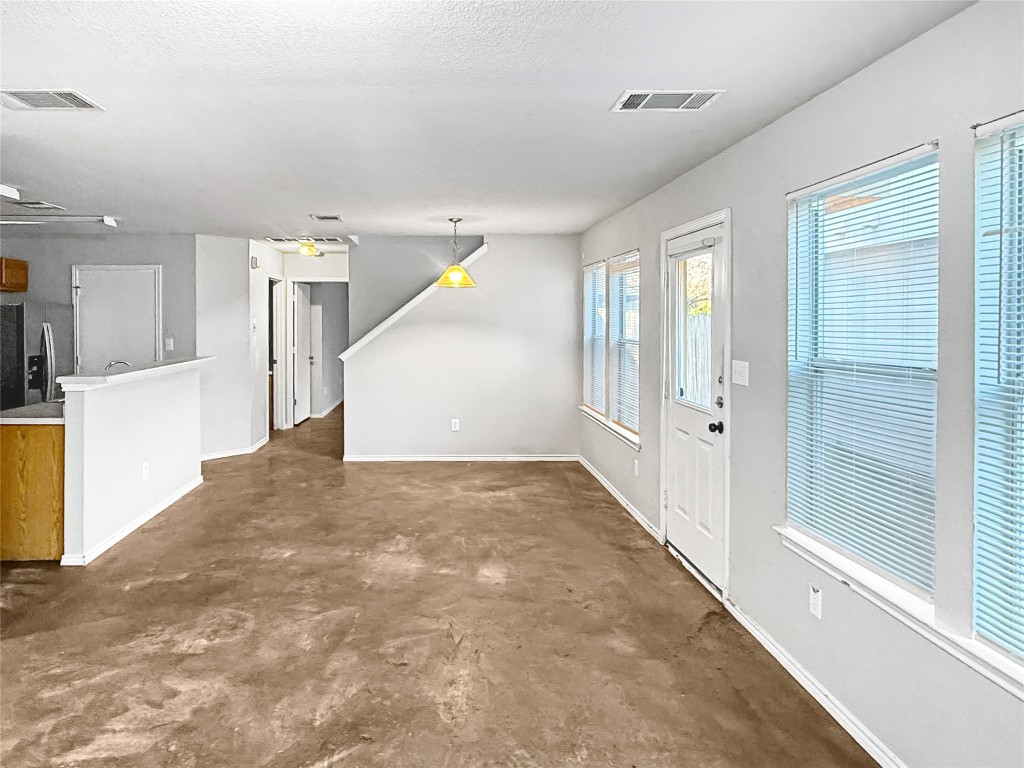 4516 Felicity Lane Austin, TX 78725 - Photo 5 of 15 a view of a hallway with wooden walls and entryway