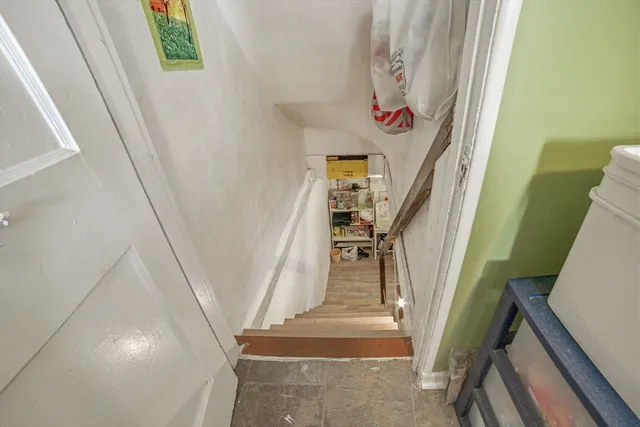a view of bedroom with a bed and wooden floor