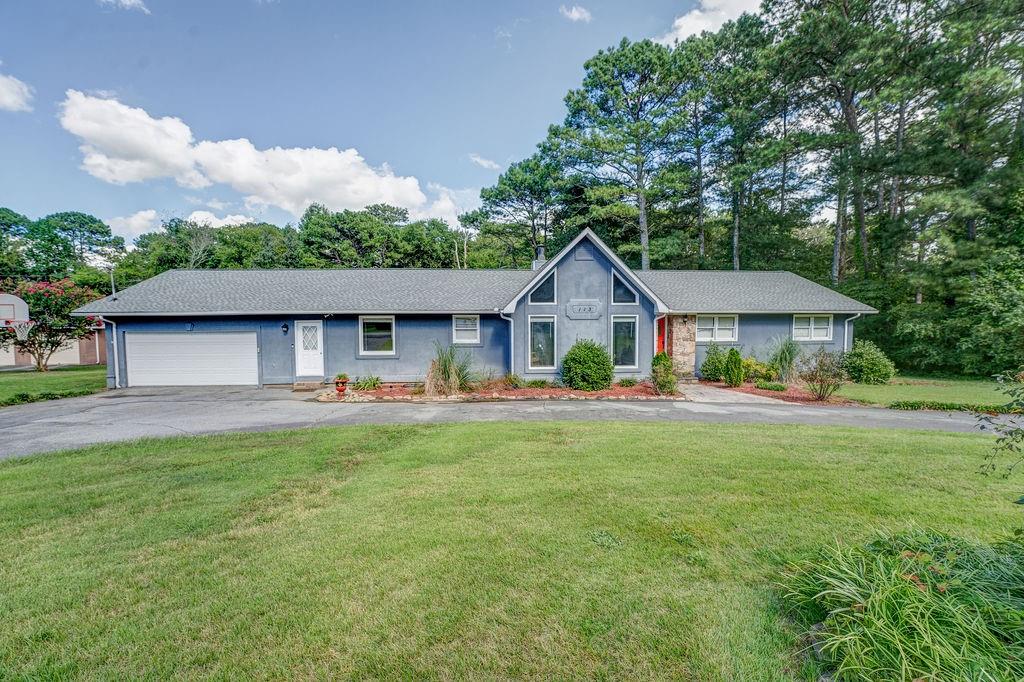 113 Derby Lane Calhoun, GA 30701 - Photo 1 of 1 a front view of house with yard and green space