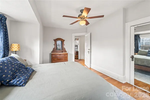 a bedroom with a bed and a view of bedroom