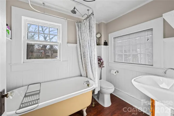 a bathroom with a sink a bathtub and a toilet