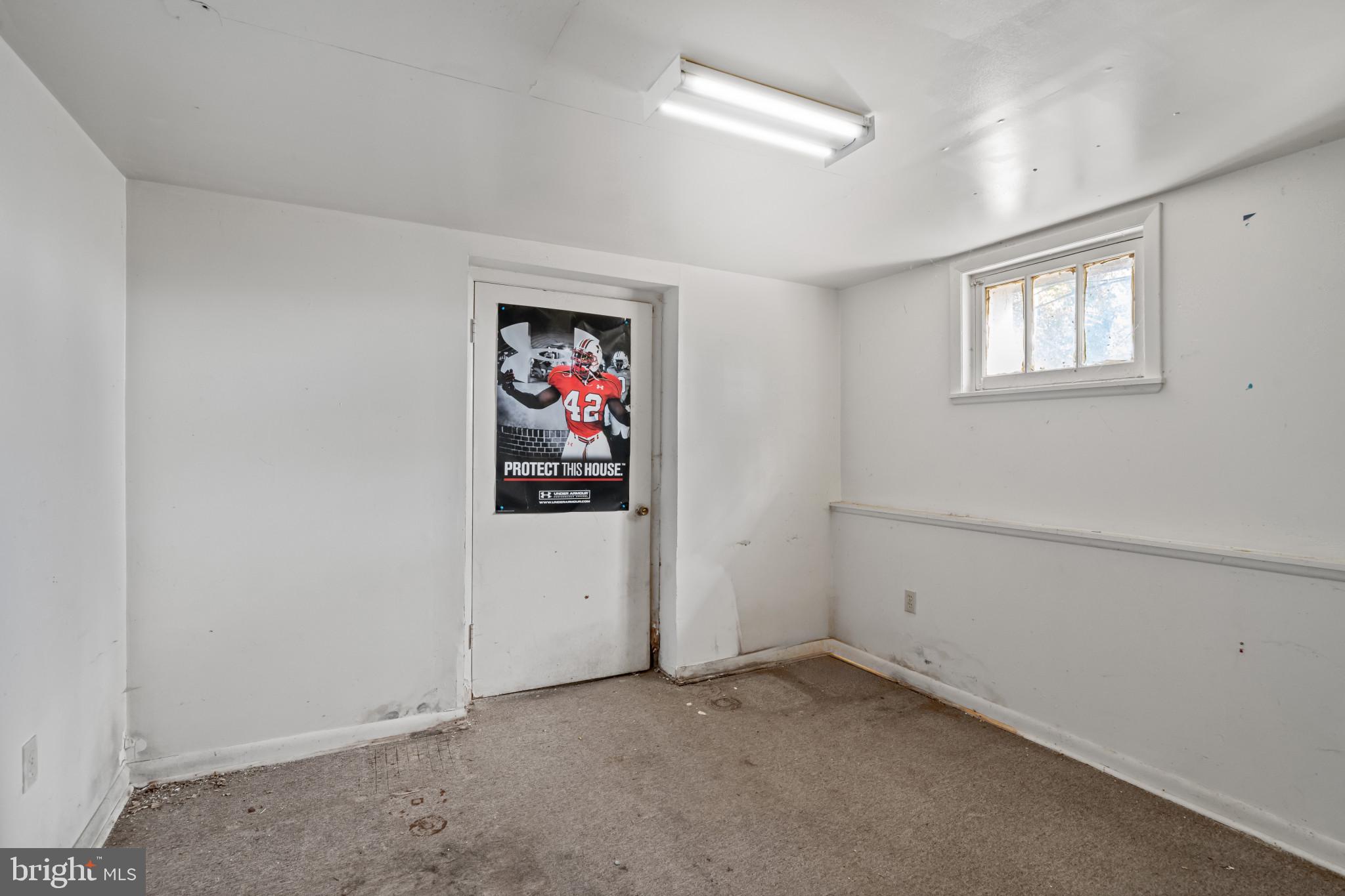 2908 Ailsa Avenue Baltimore, MD 21214 - Photo 16 of 29 wooden floor in an empty room