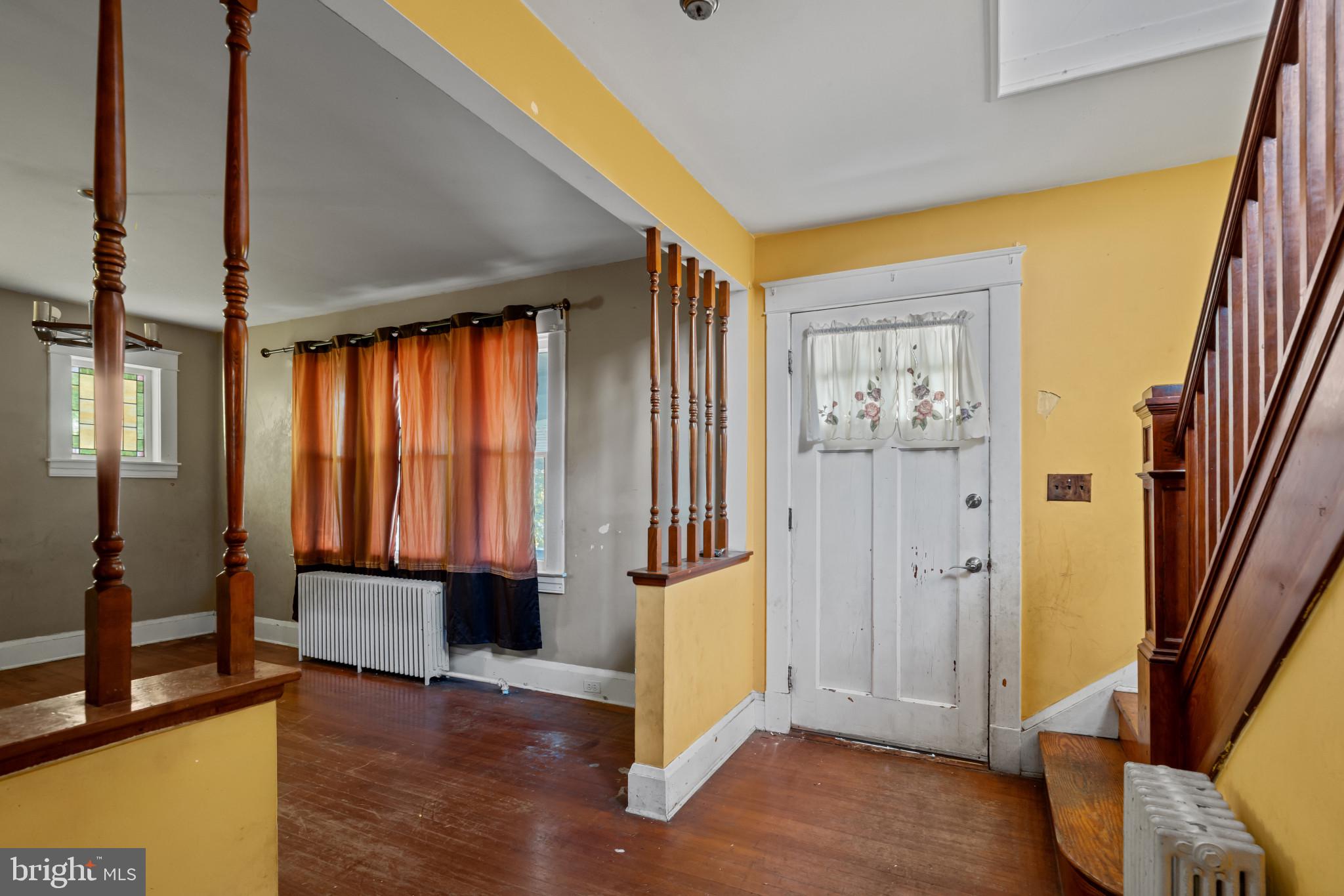 2908 Ailsa Avenue Baltimore, MD 21214 - Photo 5 of 29 a view of an entryway with wooden floor and a window