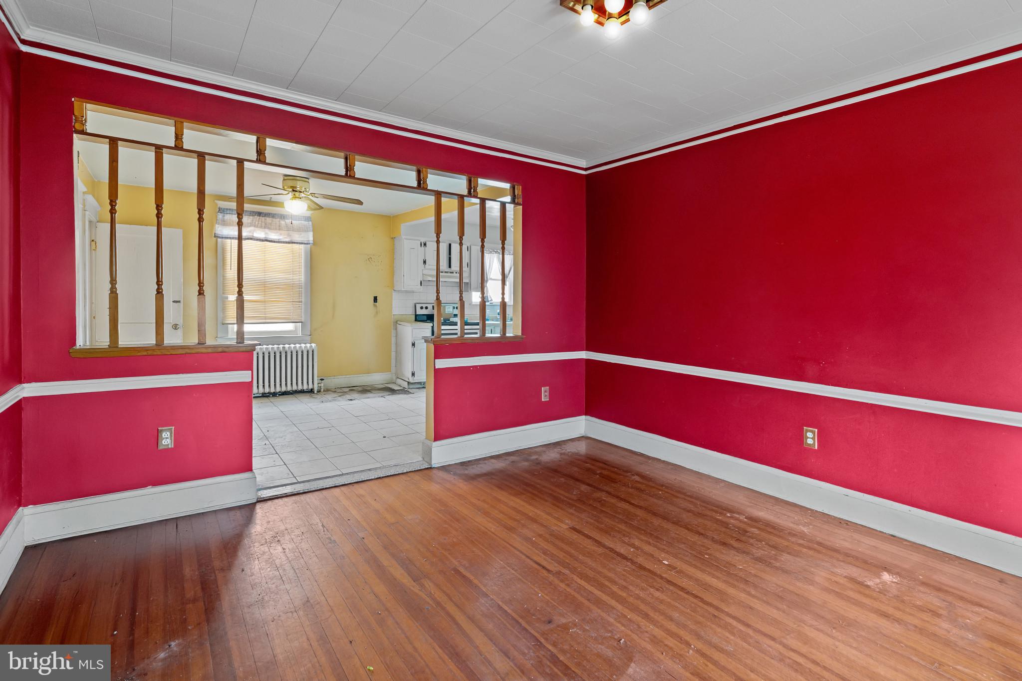 2908 Ailsa Avenue Baltimore, MD 21214 - Photo 9 of 29 a view of empty room with wooden floor and fan