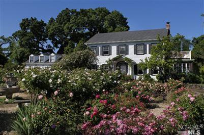571 Willowside Road Santa Rosa, CA 95401 - Photo 1 of 1 a front view of a house with a yard and potted plants