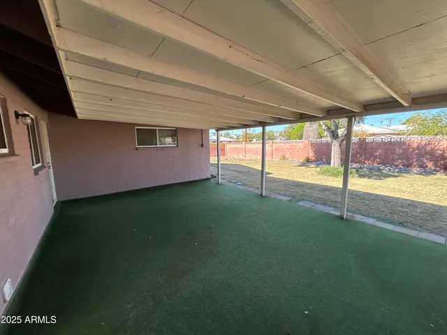 a view of a backyard of the house