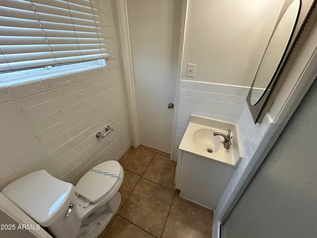 a bathroom with a toilet and a sink
