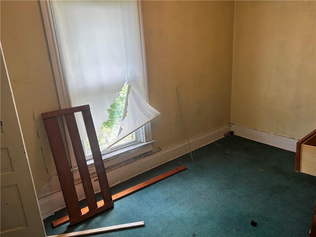 306 4th Street Monessen, PA 15062 - Photo 14 of 18 a view of an empty room with a window