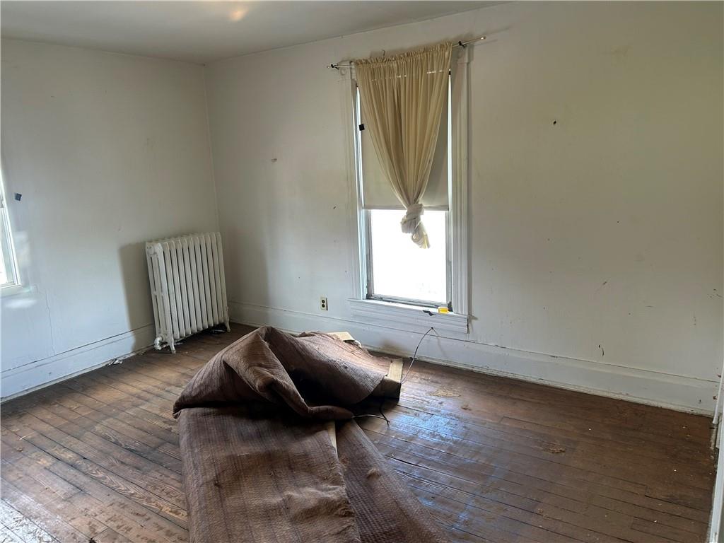 306 4th Street Monessen, PA 15062 - Photo 15 of 18 a bed room with a bed and a window