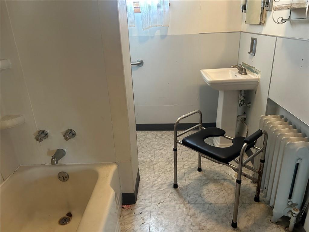306 4th Street Monessen, PA 15062 - Photo 17 of 18 a bathroom with a sink a toilet and bathtub
