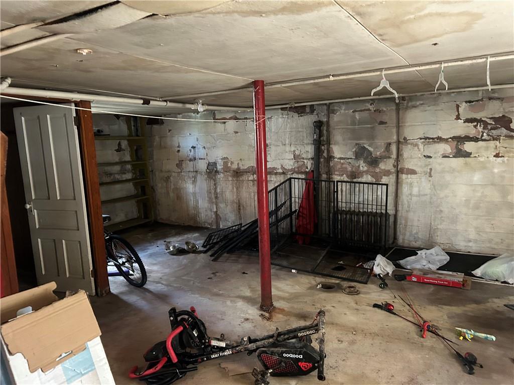 306 4th Street Monessen, PA 15062 - Photo 18 of 18 a room with water heater and a wooden door