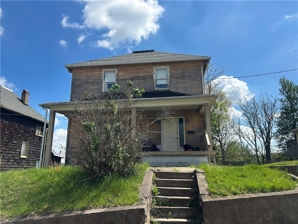306 4th Street Monessen, PA 15062 - Photo 2 of 18 a front view of a house with garden