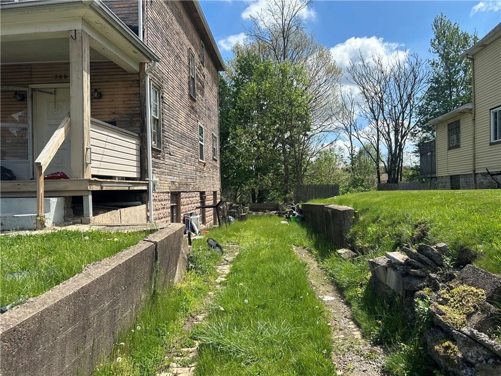 306 4th Street Monessen, PA 15062 - Photo 8 of 18 a backyard of a house with lots of green space