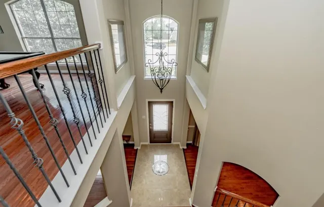 a view of entryway with wooden floor and stairs