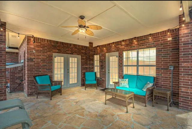a living room with furniture and a window
