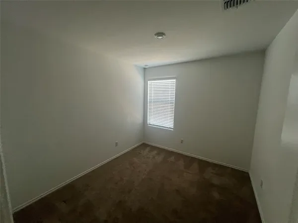 an empty room with a empty space and window