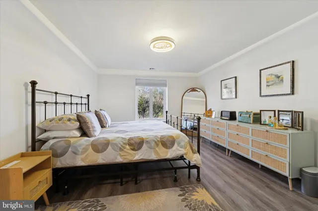 a bedroom with furniture and window