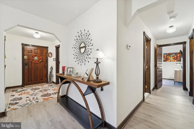 a view of a hallway with furniture and closet