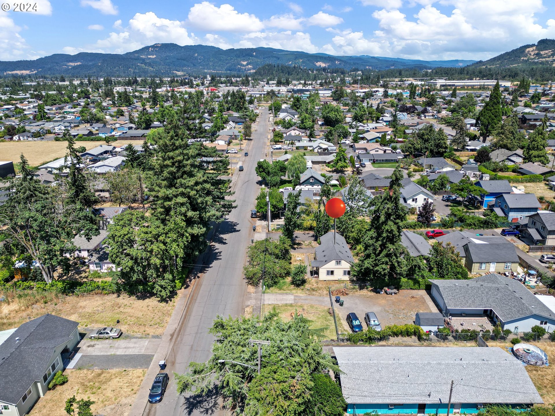 179 35th Street Springfield, OR 97478 - Photo 37 of 46 an aerial view of residential houses with outdoor space and trees