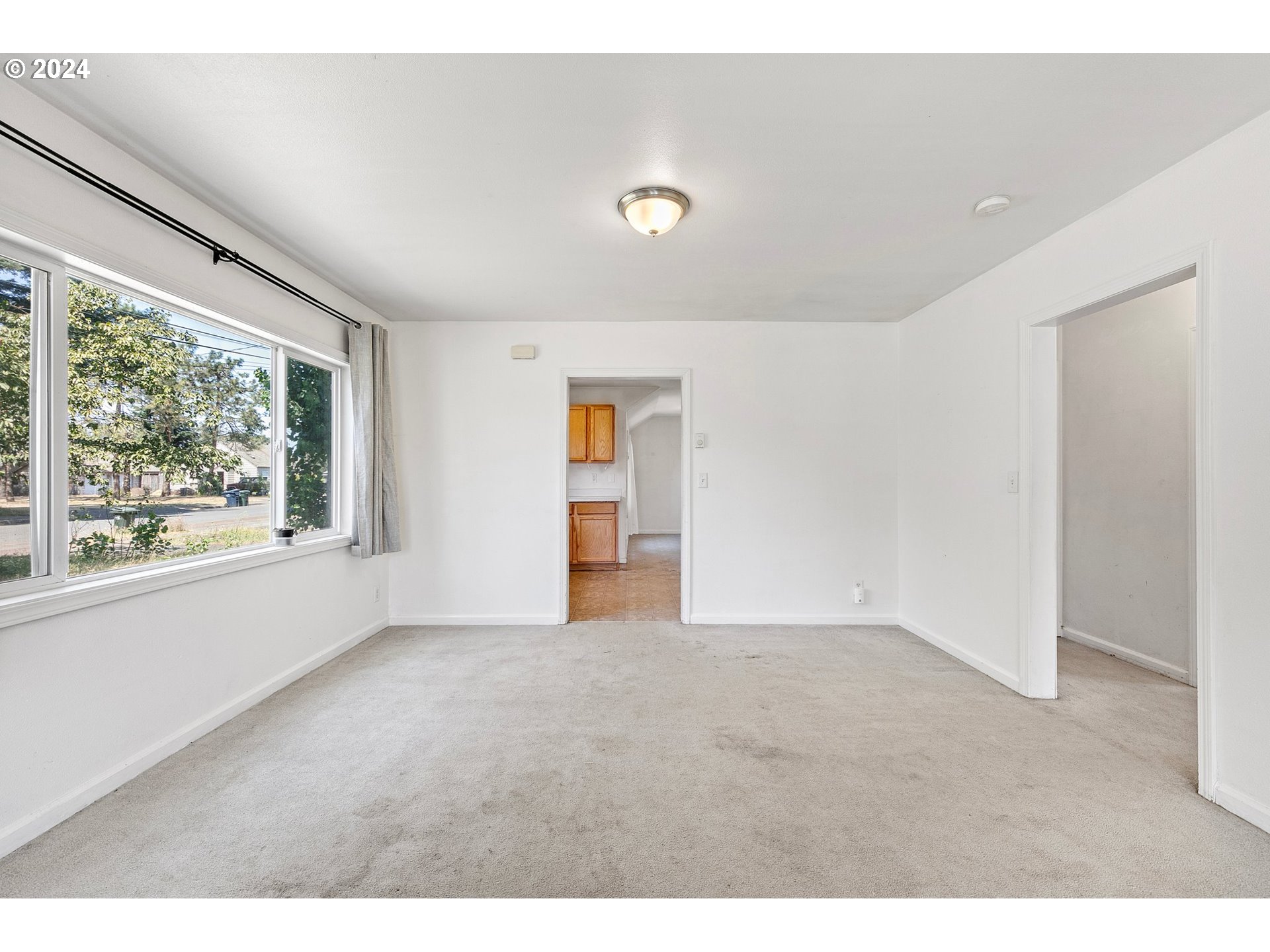 179 35th Street Springfield, OR 97478 - Photo 4 of 46 a view of an empty room with a window