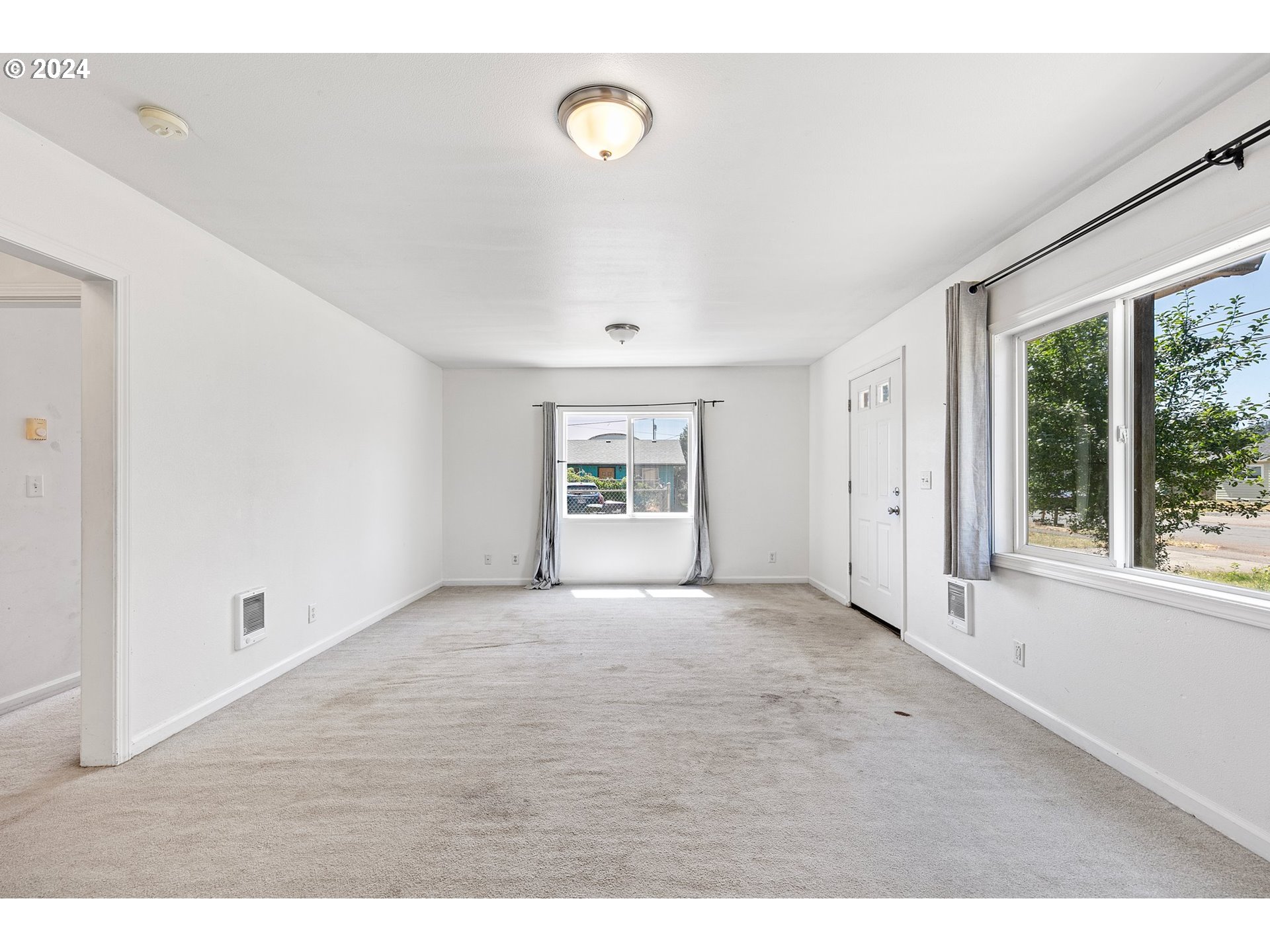 179 35th Street Springfield, OR 97478 - Photo 5 of 46 a view of an empty room with a window