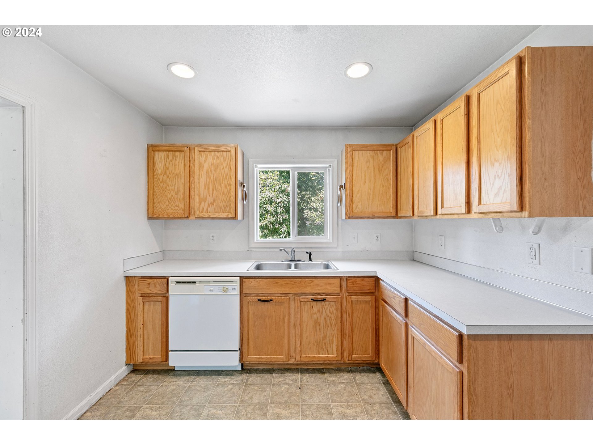 179 35th Street Springfield, OR 97478 - Photo 8 of 46 a kitchen with a sink stove and cabinets