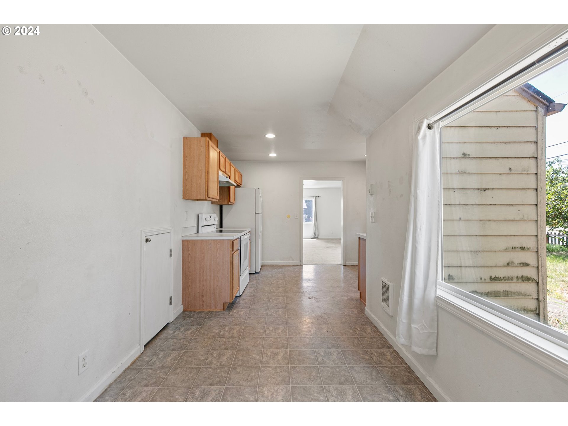 179 35th Street Springfield, OR 97478 - Photo 10 of 46 a view of a kitchen with a sink and a window