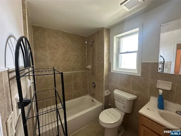 a bathroom with a toilet sink and shower
