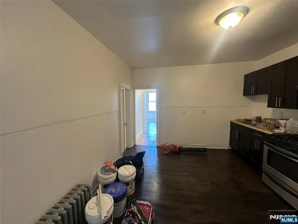 a kitchen with wooden cabinets and a stove