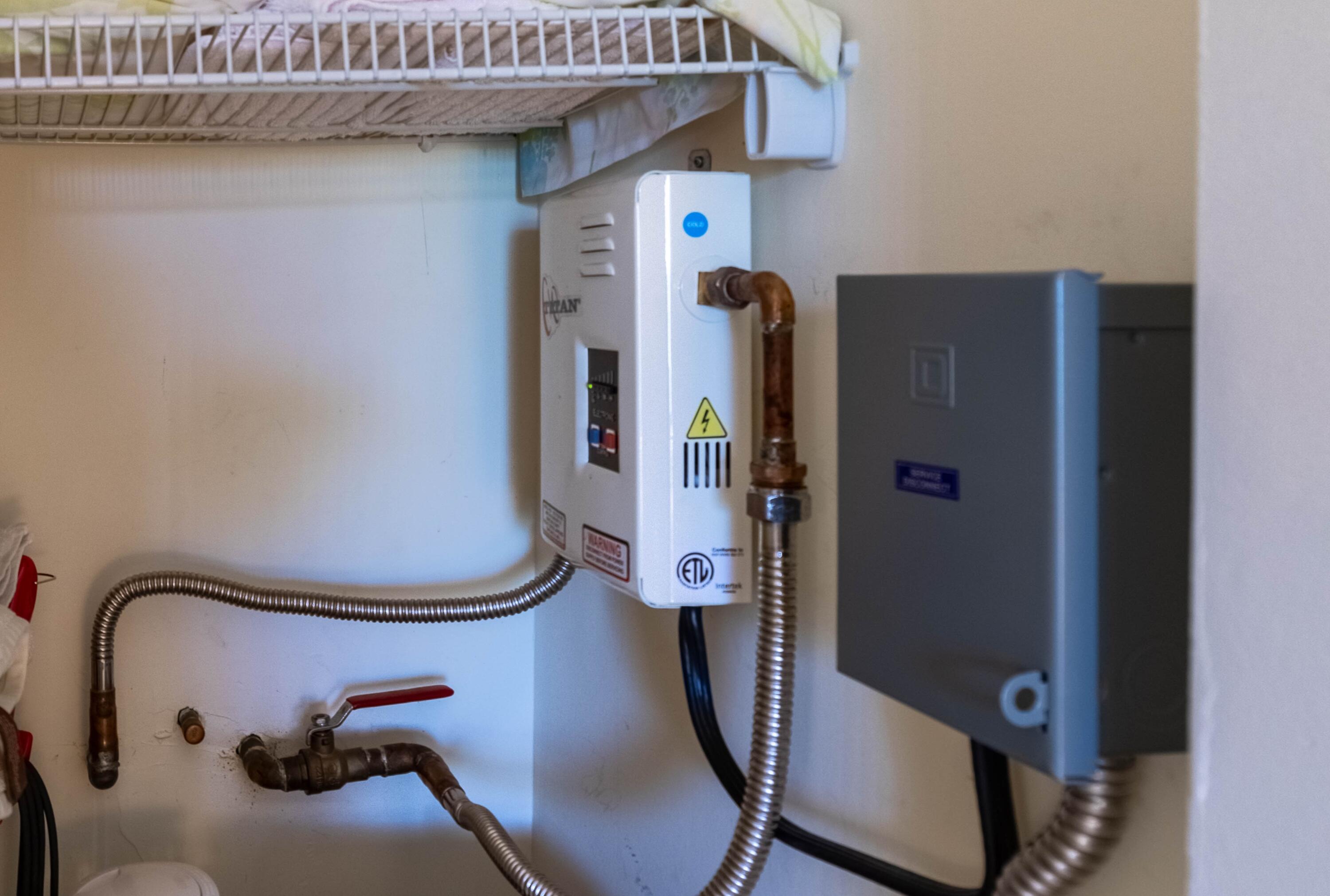 2711 Southwest 13th Street, Unit 39B Delray Beach, FL 33445 - Photo 23 of 55 Tankless Water Heater