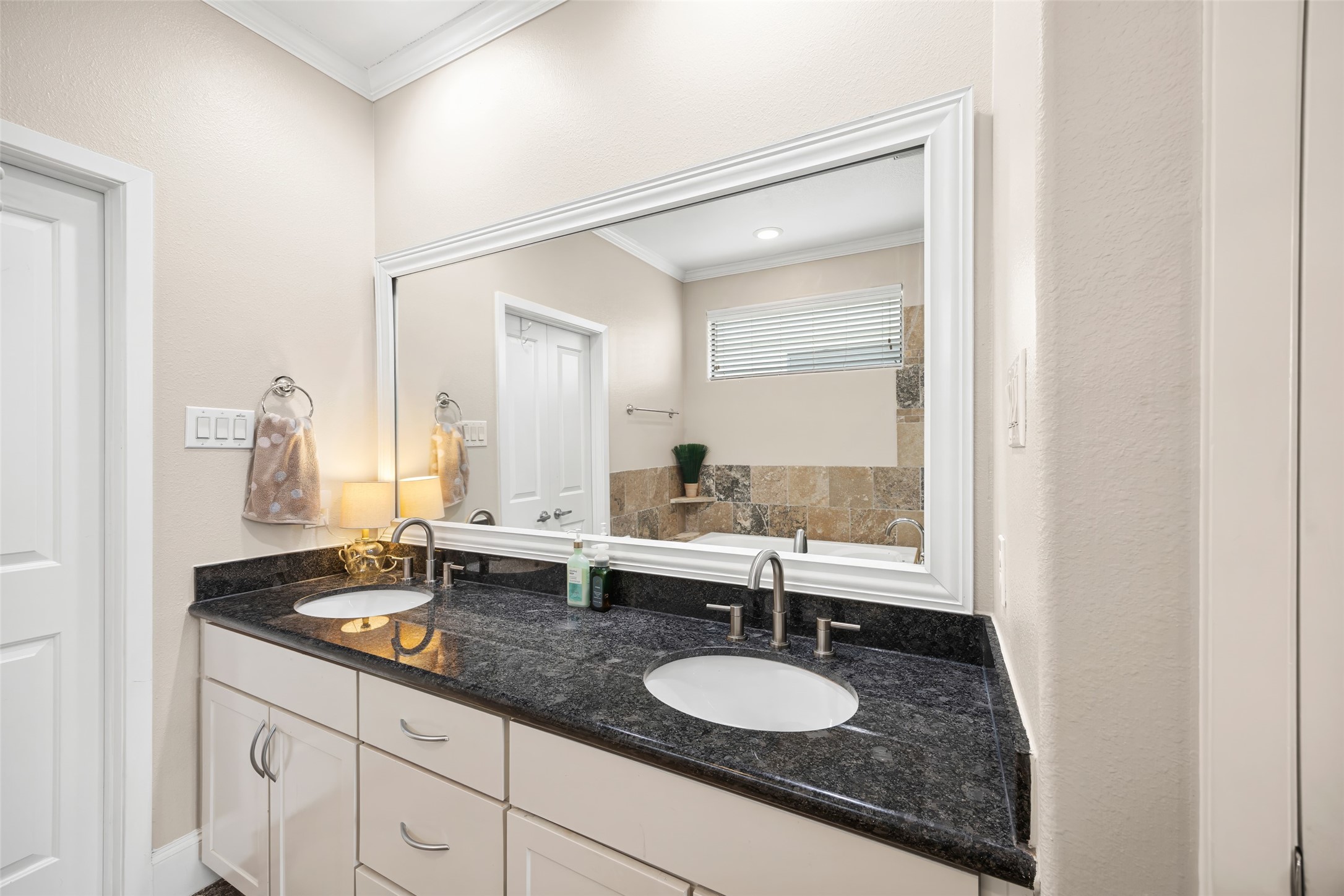 2320 Emancipation Avenue Houston, TX 77004 - Photo 27 of 38 a bathroom with a double vanity sink and a mirror