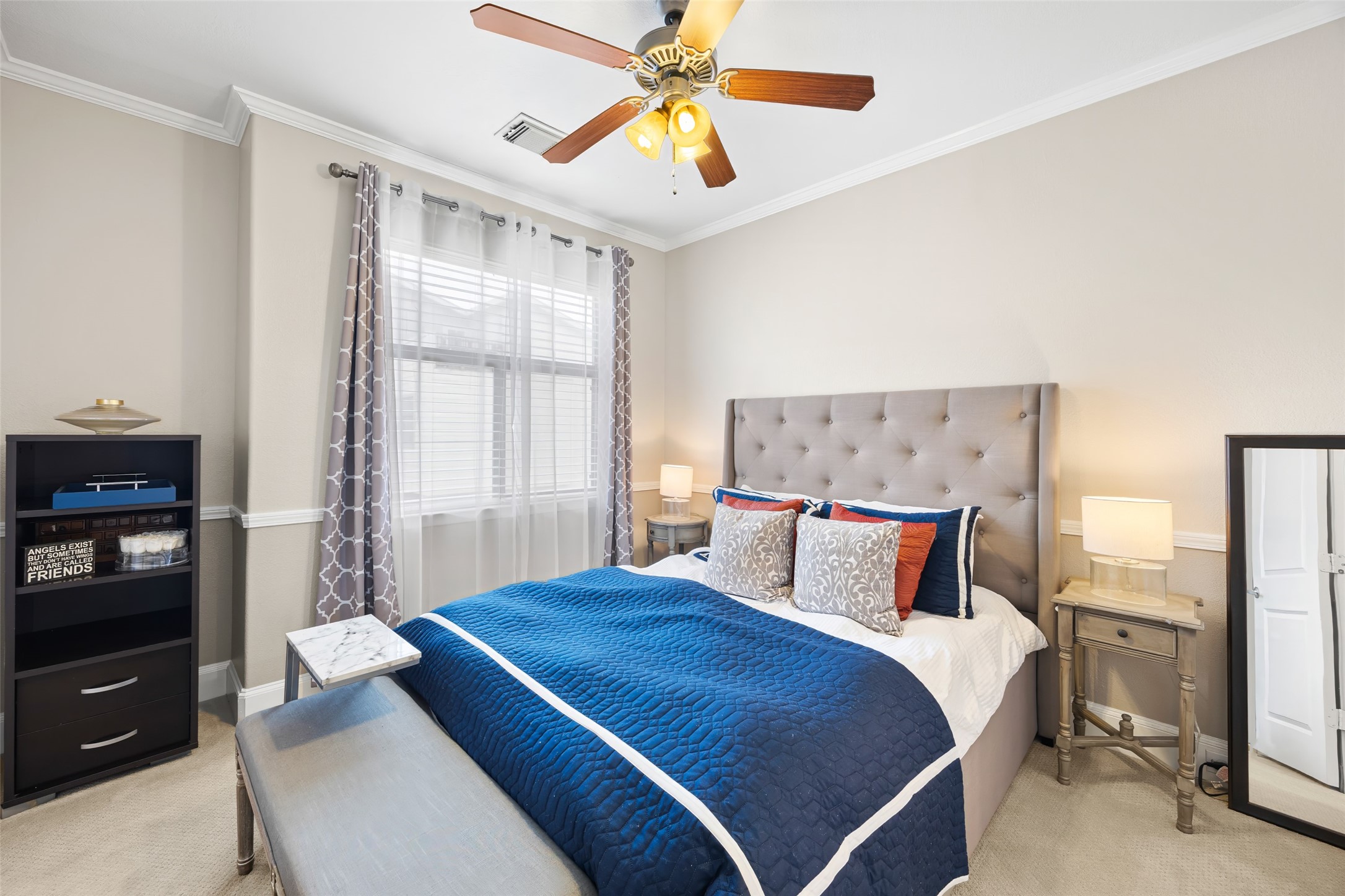 2320 Emancipation Avenue Houston, TX 77004 - Photo 31 of 38 a bedroom with a bed and a chandelier