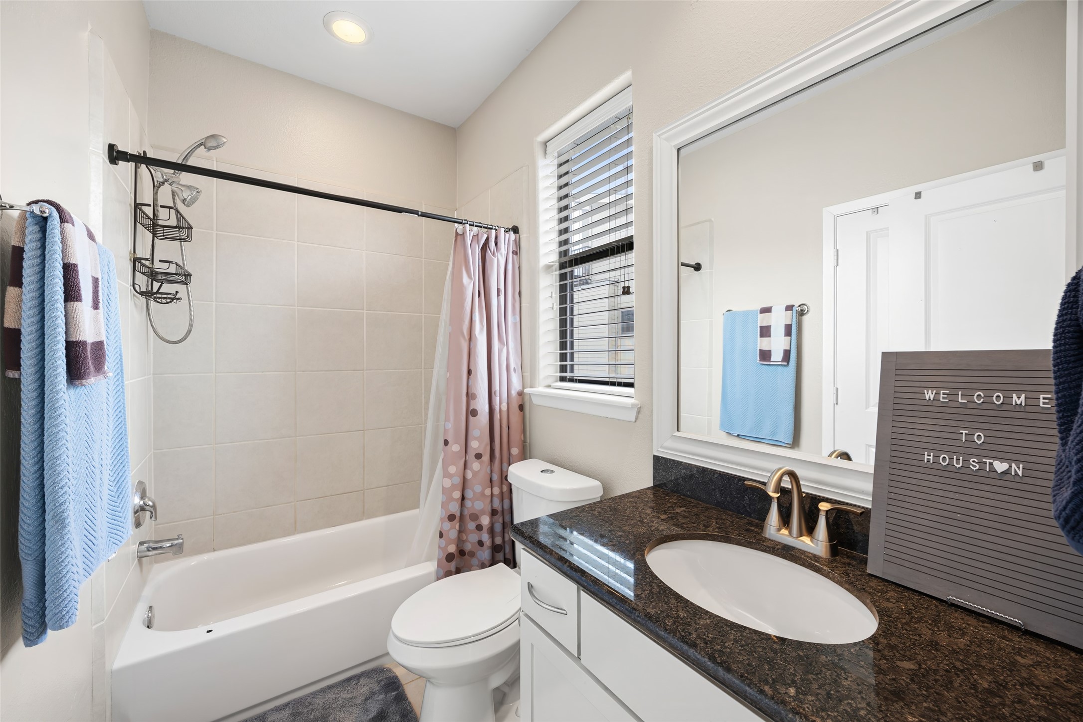 2320 Emancipation Avenue Houston, TX 77004 - Photo 32 of 38 a bathroom with a granite countertop sink toilet tub and shower