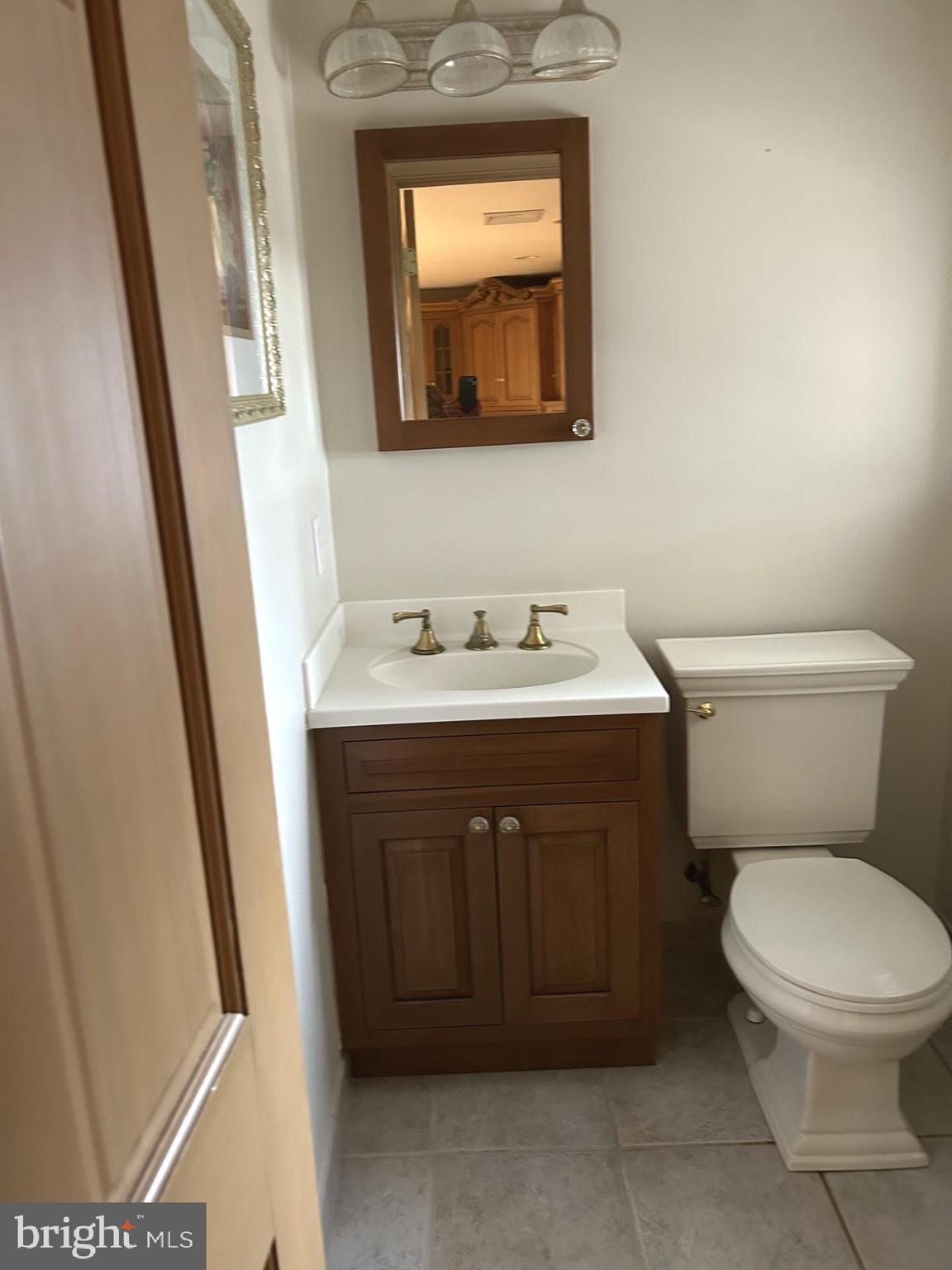 88 West Rambler Drive Southampton, PA 18966 - Photo 15 of 17 a bathroom with a toilet sink and mirror