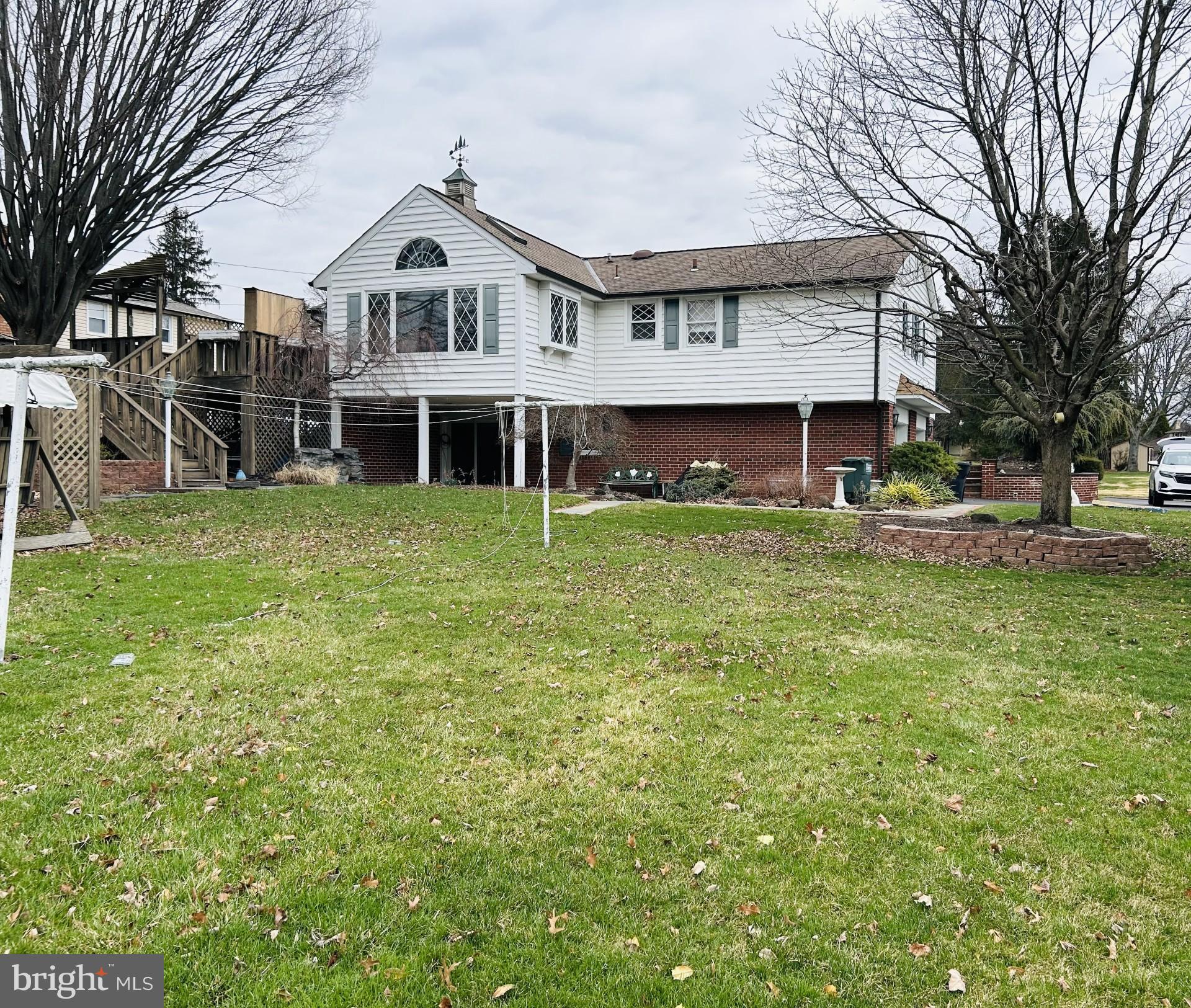 88 West Rambler Drive Southampton, PA 18966 - Photo 17 of 17 a front view of a house with a garden and trees