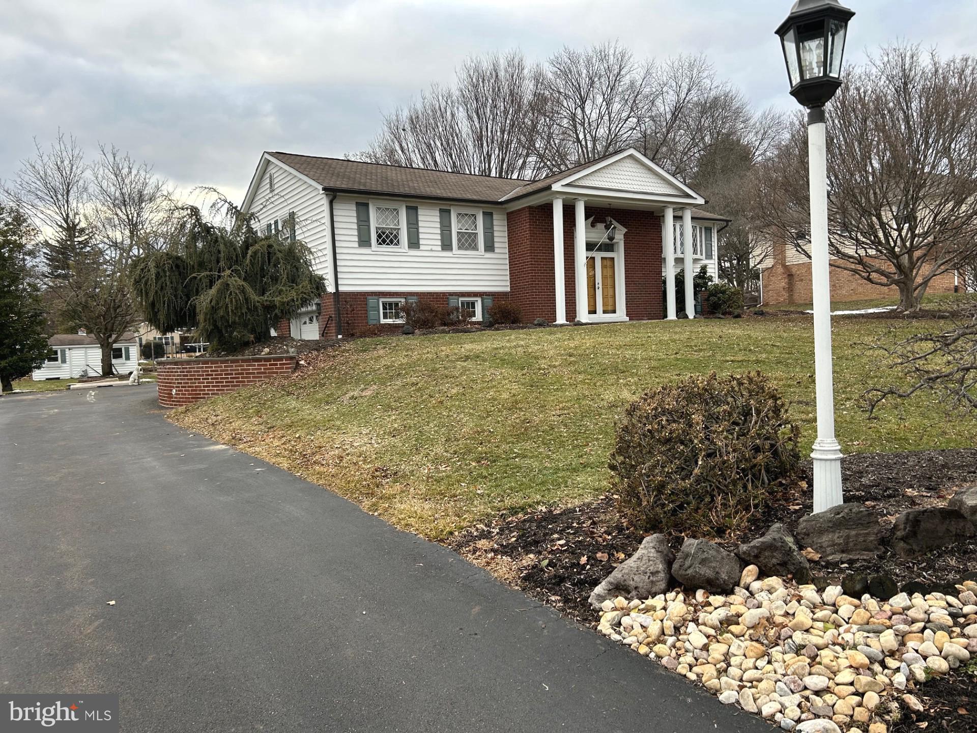 88 West Rambler Drive Southampton, PA 18966 - Photo 2 of 17 a front view of a house with garden