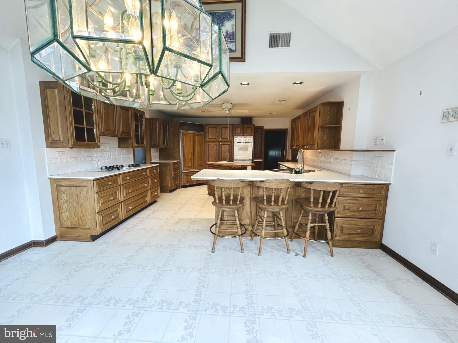 88 West Rambler Drive Southampton, PA 18966 - Photo 4 of 17 a room with stainless steel appliances kitchen island granite countertop a sink and cabinets