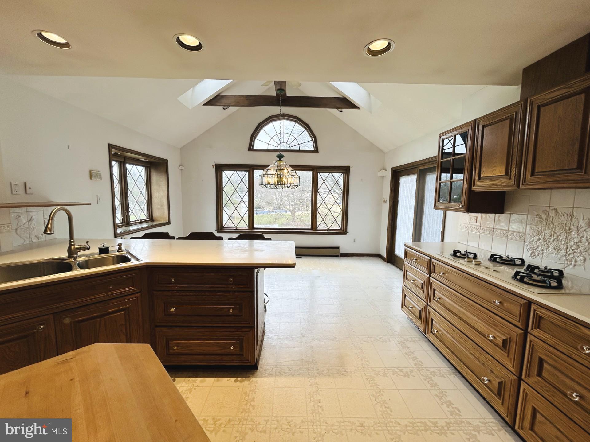 88 West Rambler Drive Southampton, PA 18966 - Photo 5 of 17 a large kitchen with stainless steel appliances granite countertop a stove and a sink
