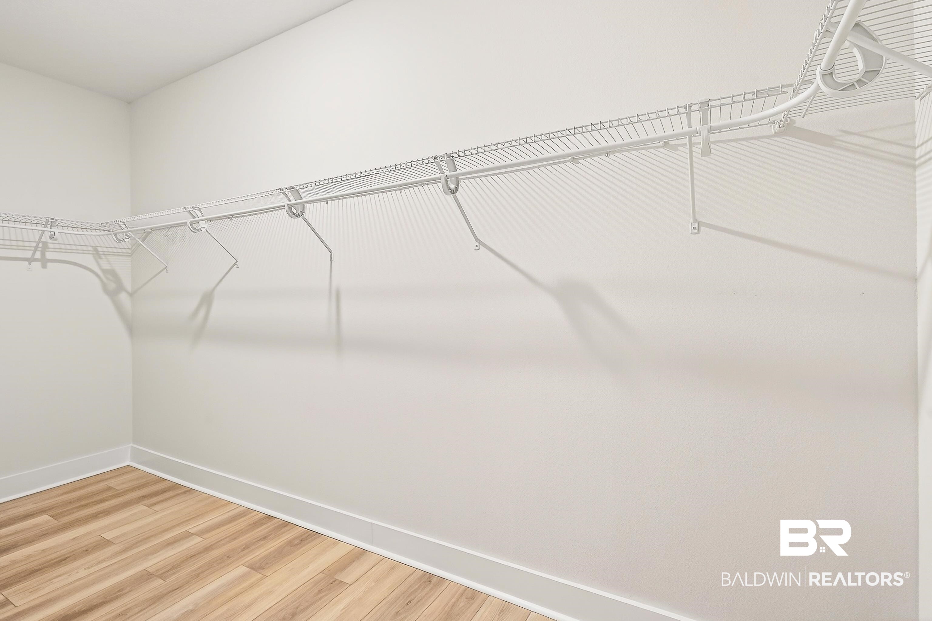 1728 Partridge Street Foley, AL 36535 - Photo 22 of 37 Walk in closet featuring wood finished floors