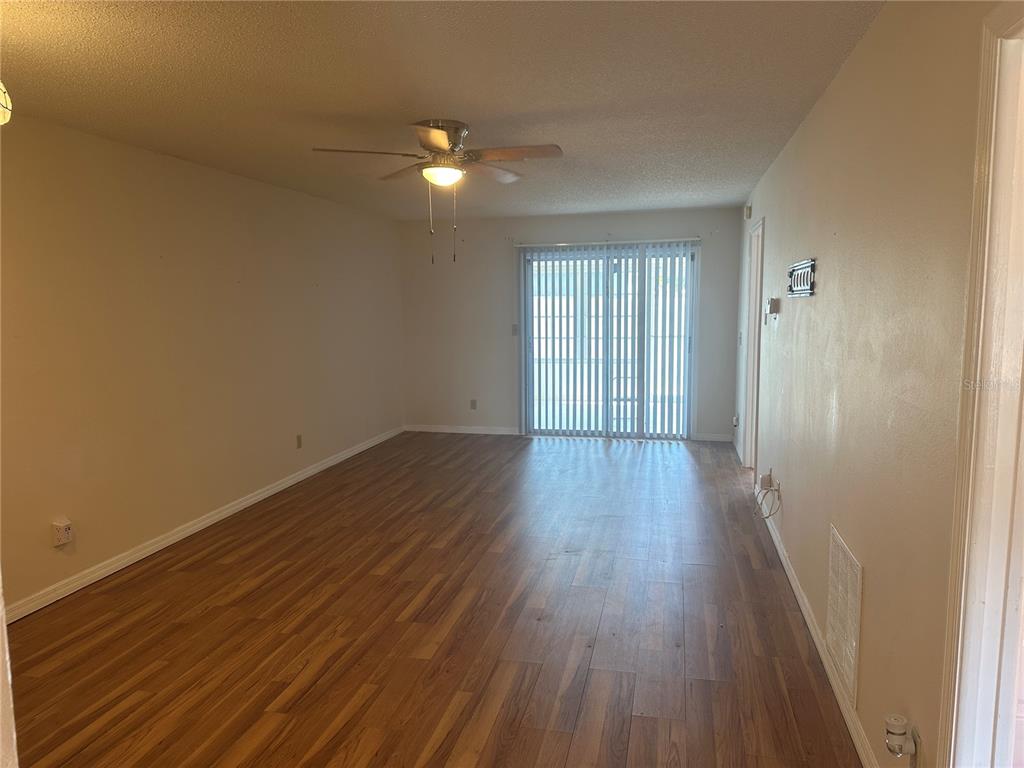 2250 Druid Road, Unit 403 Clearwater, FL 33764 - Photo 6 of 17 a view of a room with wooden floor and window