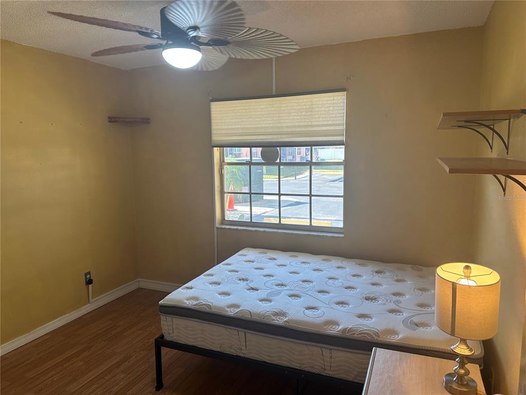 2250 Druid Road, Unit 403 Clearwater, FL 33764 - Photo 7 of 17 a room that has a bed and a window