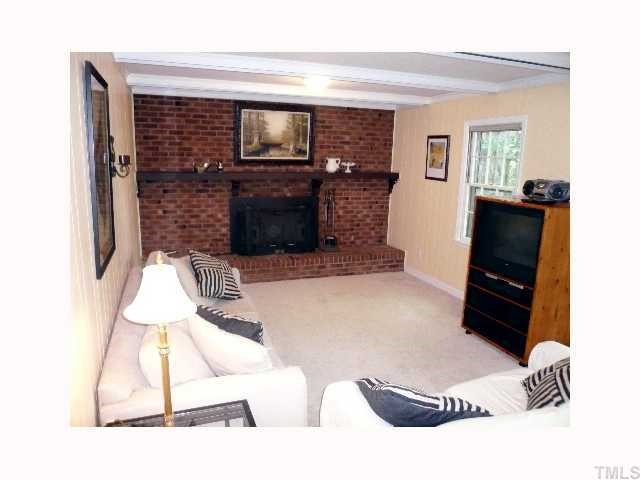5508 Fieldstone Drive Raleigh, NC 27609 - Photo 8 of 12 a living room with furniture and a flat screen tv