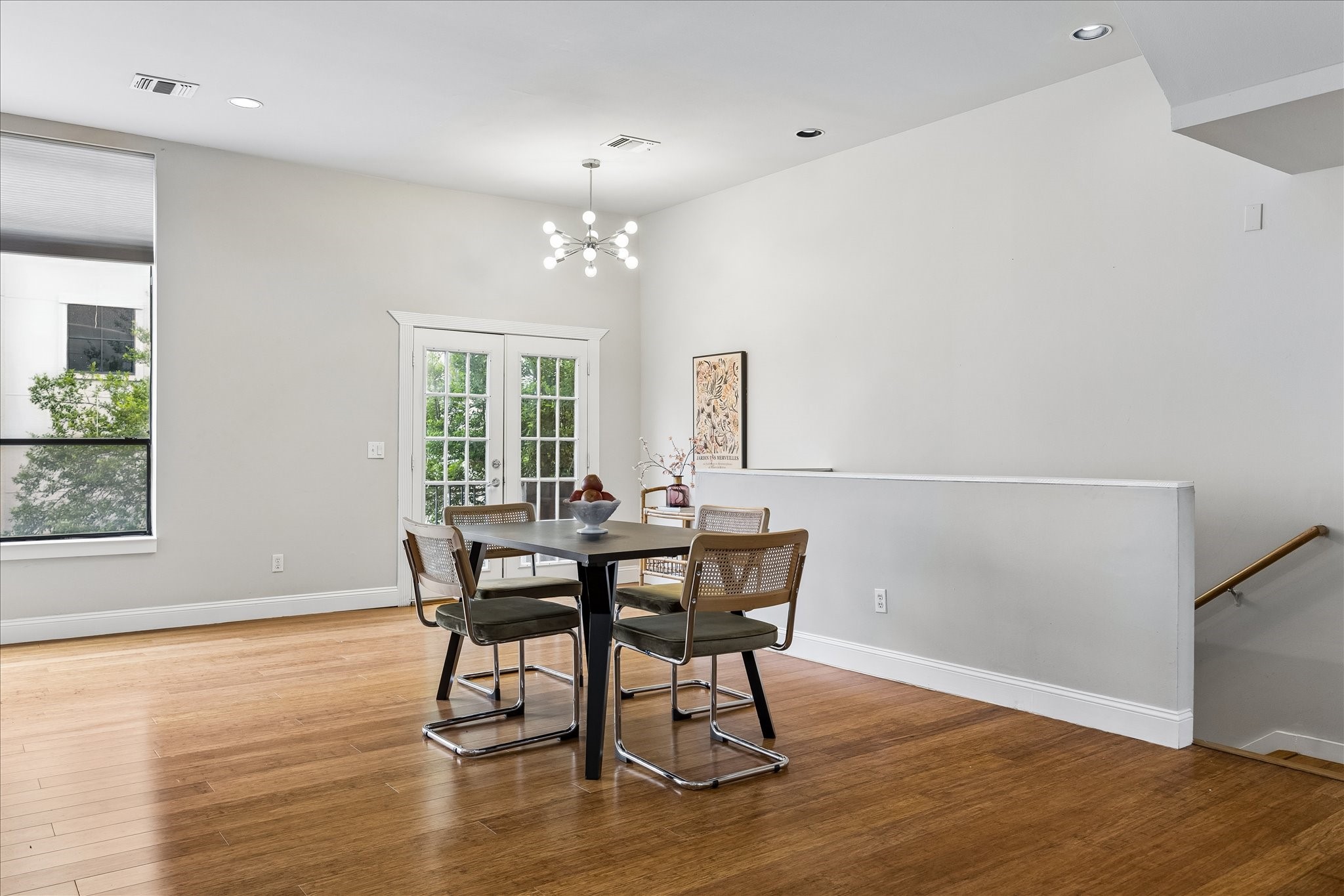 939 Colorado Street, Unit 22 Houston, TX 77007 - Photo 9 of 23 a view of a dining room with furniture and wooden floor